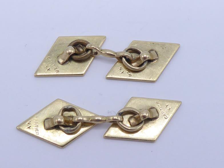 Cartier, a pair of gold cufflinks, the rhomboid links stamped 'CARTIER N.Y' verso, to chain - Image 2 of 3