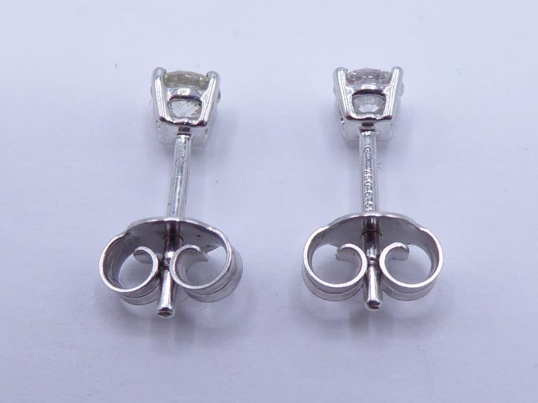 A pair of single stone diamond ear studs, each brilliant approx. 0.25 carat, mounted in 18 carat - Image 2 of 3