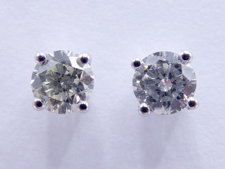 A pair of single stone diamond ear studs, each brilliant approx. 0.25 carat, mounted in 18 carat