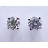 A pair of single stone diamond ear studs, each brilliant approx. 0.25 carat, mounted in 18 carat