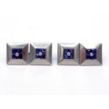 A pair of French platinum, sapphire and diamond cufflinks, the square links set to the centre with a