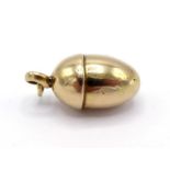 A Russian 56 standard gold charm, modelled as an acorn, marks to suspension ring, 5gms