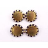 A pair of French 18 carat gold and enamel cufflinks, the circular links with blue and white dart