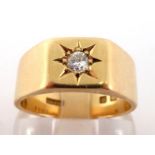 An 18 carat gold and diamond gentleman's ring, gypsy set to the centre with a small approx. 0.10