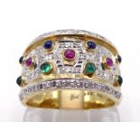 A multi gem set dress ring, the wide band set with rows of small cabochon cut rubies, sapphires, and