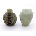 Two Chinese carved celadon jade ornaments, one snuff bottle carved in relief with pine trees and