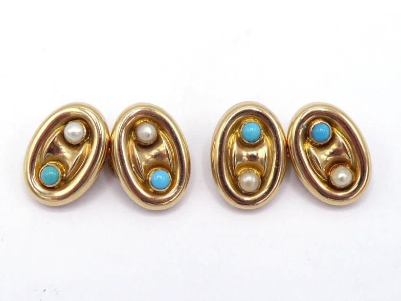 A pair of turquoise and seed pearl cufflinks, the oval links each with a small collet set