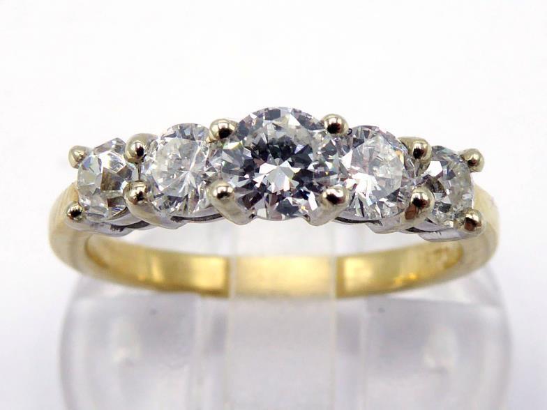 A five stone diamond ring, composed of graduated modern and old cut stones, the centre stone approx.