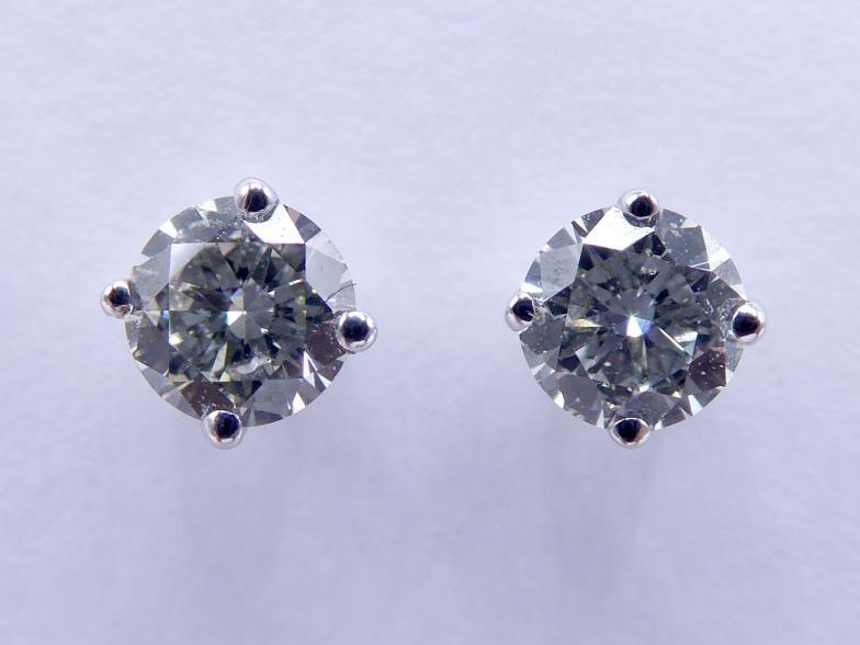 A pair of single stone diamond ear studs, each brilliant approx. 0.18 carat, mounted in 18 carat