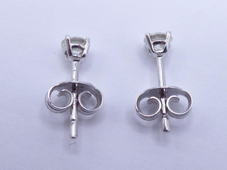 A pair of single stone diamond ear studs, each brilliant approx. 0.18 carat, mounted in 18 carat - Image 2 of 3