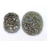 Two Chinese celadon jade oval plaques, one carved and pierced as a dragon chasing a flaming pearl