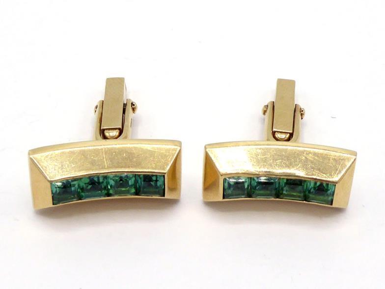 A pair of tourmaline cufflinks, the curved rectangular bars set to the centre with a line of calibre