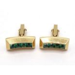 A pair of tourmaline cufflinks, the curved rectangular bars set to the centre with a line of calibre