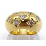 A diamond bombe ring, gypsy set with a grid of seven brilliants, totalling approx. 0.56 carat, the