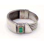 MANFREDI, an Italian silver and chrysoprase bangle, the rectangular cabochon stone mounted in a gold