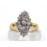 A diamond plaque ring, the navette shaped bezel pave set overall with small old cut brilliants (