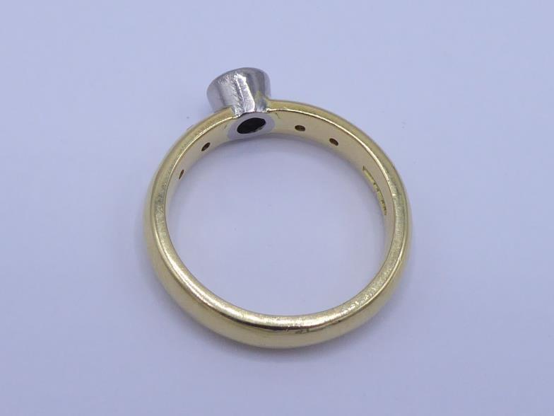 An 18 carat gold and diamond ring, the central brilliant approx. 0.28 carat, collet set above two - Image 2 of 4