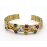 MARCO BICEGO, 'Jaipur Collection', an 18 carat gold and multigem cuff bracelet, the five textured