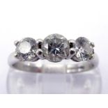 A diamond three stone ring, the three graduated old cuts totalling approx. 0.87 carat, claw set in a