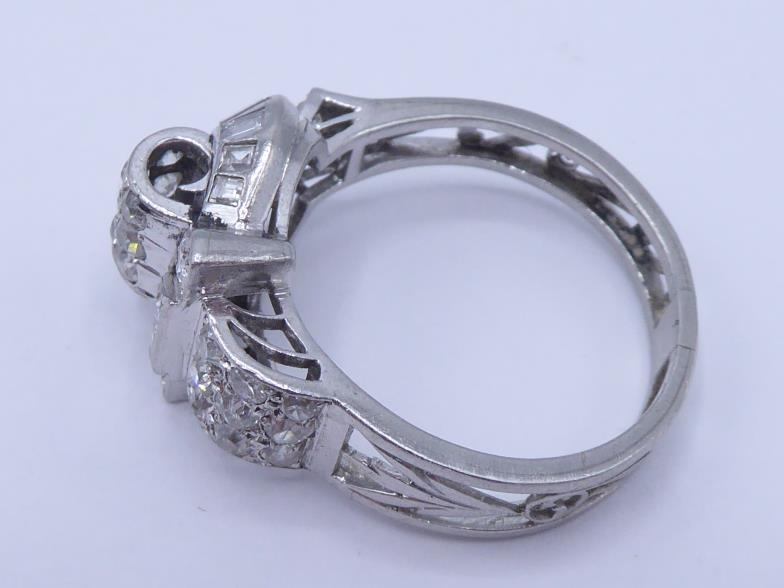 A mid 20th century diamond dress ring, the ornate buckle design set overall with single cuts and - Image 2 of 4