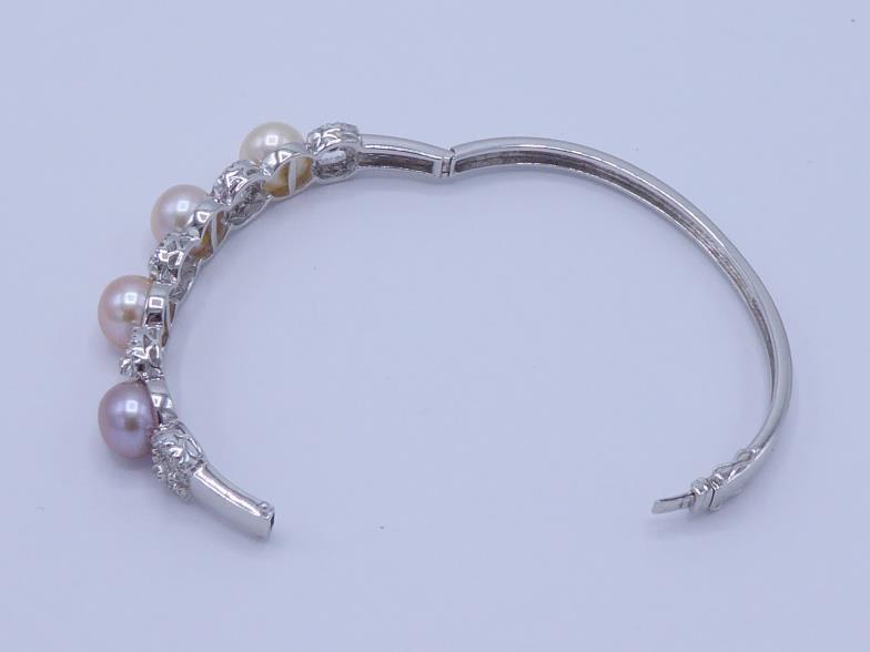 A cultured bouton pearl and diamond hinged bangle, the front set with four 9.5mm diameter pearls, - Image 3 of 4