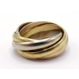 CARTIER, 'must de Cartier', an 18 carat three colour gold five band 'Trinity' ring, French poincon