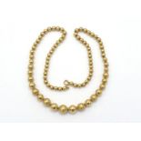 An Italian 18 carat gold bead necklace, composed of alternate matt and polished graduated beads, the