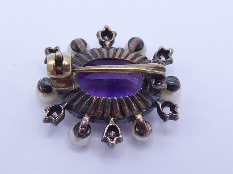 A Victorian amethyst, diamond and seed pearl brooch, the central oval cut amethyst 12 x 8mm, in a - Image 2 of 3