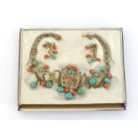 A mid 20th century Chinese silver gilt, coral and turquoise necklace, the central openwork motifs