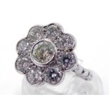 A diamond daisy cluster dress ring, the central collet set brilliant approx. 0.48 carat, in a