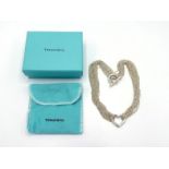 TIFFANY & Co., a silver 'Heart' necklace, the central heart 24mm wide, to multi strand fine link