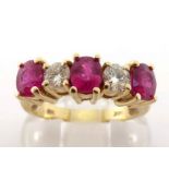 A diamond and ruby five stone ring, set with alternate 5 x 4mm oval rubies and 0.20 carat