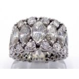 A diamond wedding band, the central row claw set with graduated marquise cuts totalling approx. 5.91