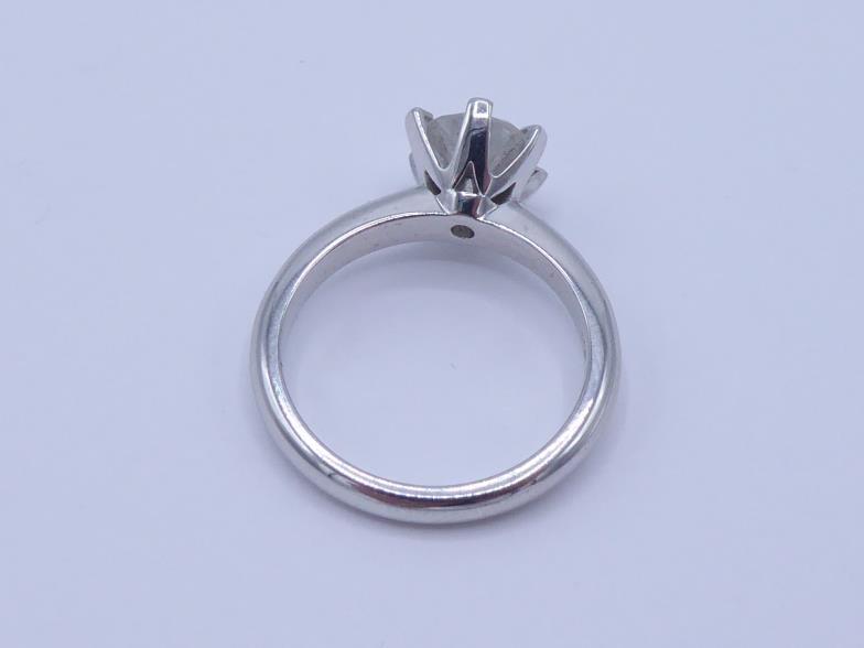 A single stone diamond ring, the central brilliant approx. 1.41 carat, the 18 carat white gold shank - Image 2 of 3