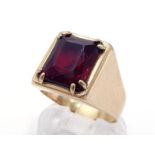 A gentleman's yellow metal (tests 18 carat gold) and synthetic ruby set ring, the mixed