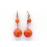 A pair of coral and diamond earrings, the large circular drops 16mm diameter, each set with a