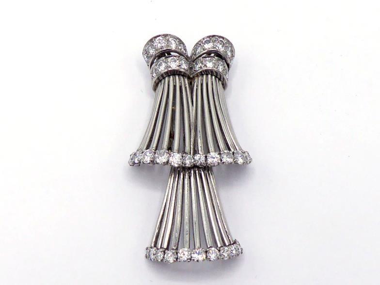 A French platinum and diamond brooch / pendant, late 1940s, the principal skirt of platinum bars