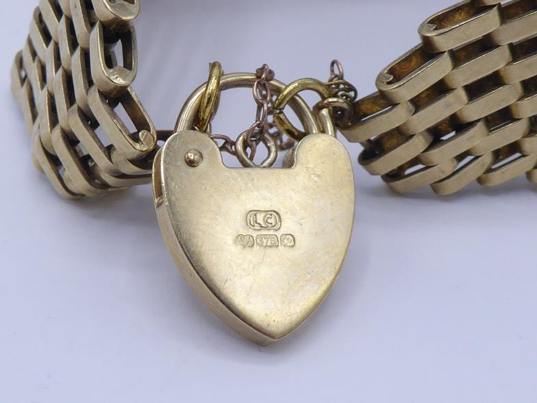 A 9 carat gold gate link bracelet, each link eight bars deep, to a heart shaped padlock clasp, fully - Image 2 of 3