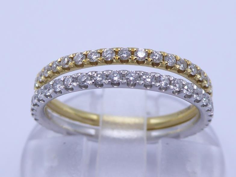 A pair of 18 carat gold and diamond eternity bands, each band 1.7mm wide, in white and pink gold, - Image 2 of 3