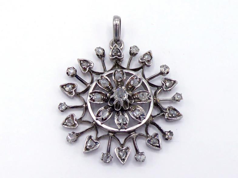 A Victorian diamond starburst pendant, the circular starburst set overall with rose cuts, mounted in