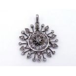 A Victorian diamond starburst pendant, the circular starburst set overall with rose cuts, mounted in