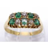 A 1930s 18 carat gold, emerald and diamond ring, composed of a checker board bezel of small round