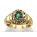 An Italian 18 carat gold, emerald and cubic zirconia cluster ring, the small central oval cut