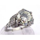 A fine Art Deco single stone diamond ring, the central brilliant approx. 2.15 carats, claw set above