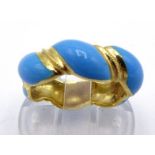 A yellow metal (tests 18 carat gold) and blue enamel band ring, spiral design, finger size M, 5.1gms