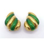 A pair of yellow metal (tests 18 carat gold) and enamel ear clips, the gadrooned clips with