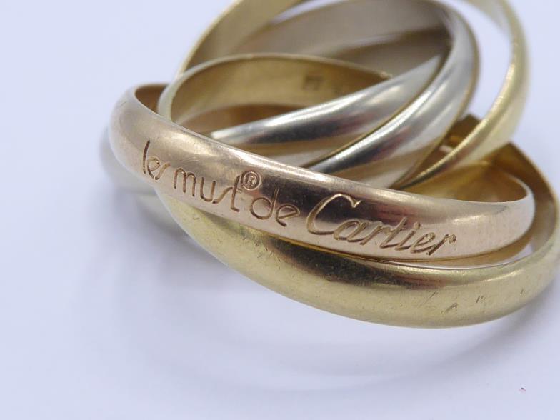 CARTIER, 'must de Cartier', an 18 carat three colour gold five band 'Trinity' ring, French poincon - Image 3 of 3