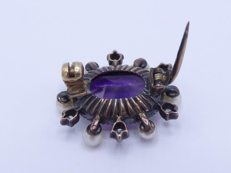 A Victorian amethyst, diamond and seed pearl brooch, the central oval cut amethyst 12 x 8mm, in a - Image 3 of 3