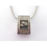 A diamond pendant, in the style of Chopard, the oval section pendant pave set overall with small