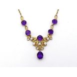 A 9 carat gold, amethyst and seed pearl fringe necklace, the central textured scrolling fringe set